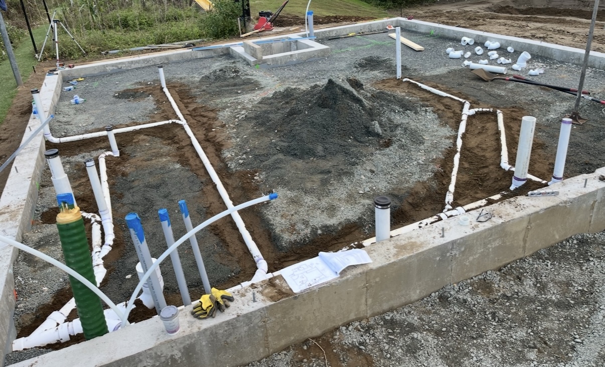 Under-slab water and waste rough-in laid out inside a new foundation by Platinum Plumbing